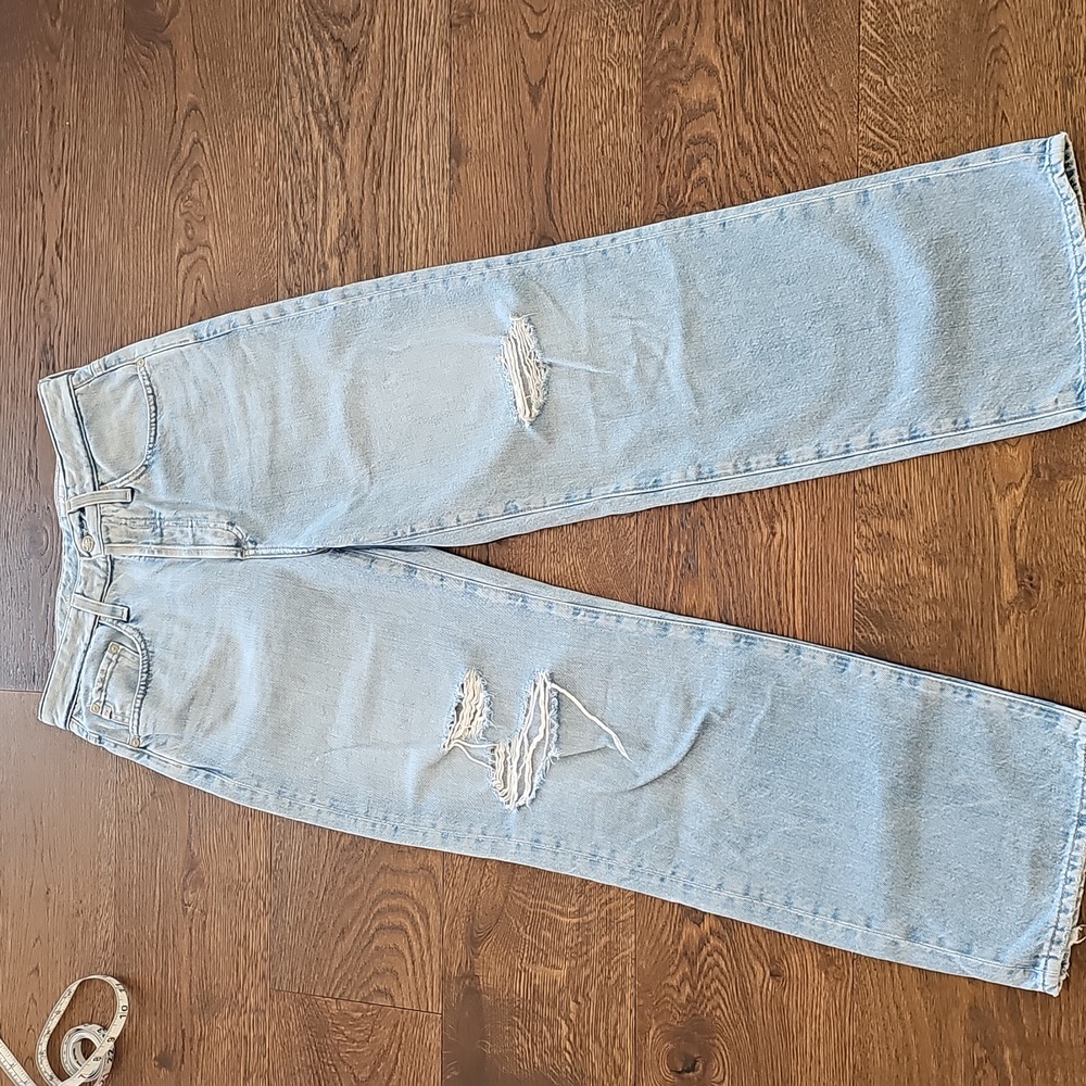 AG high rise boyfriend fit . Light blue. Knee rips. Size 26. Fits like a 27